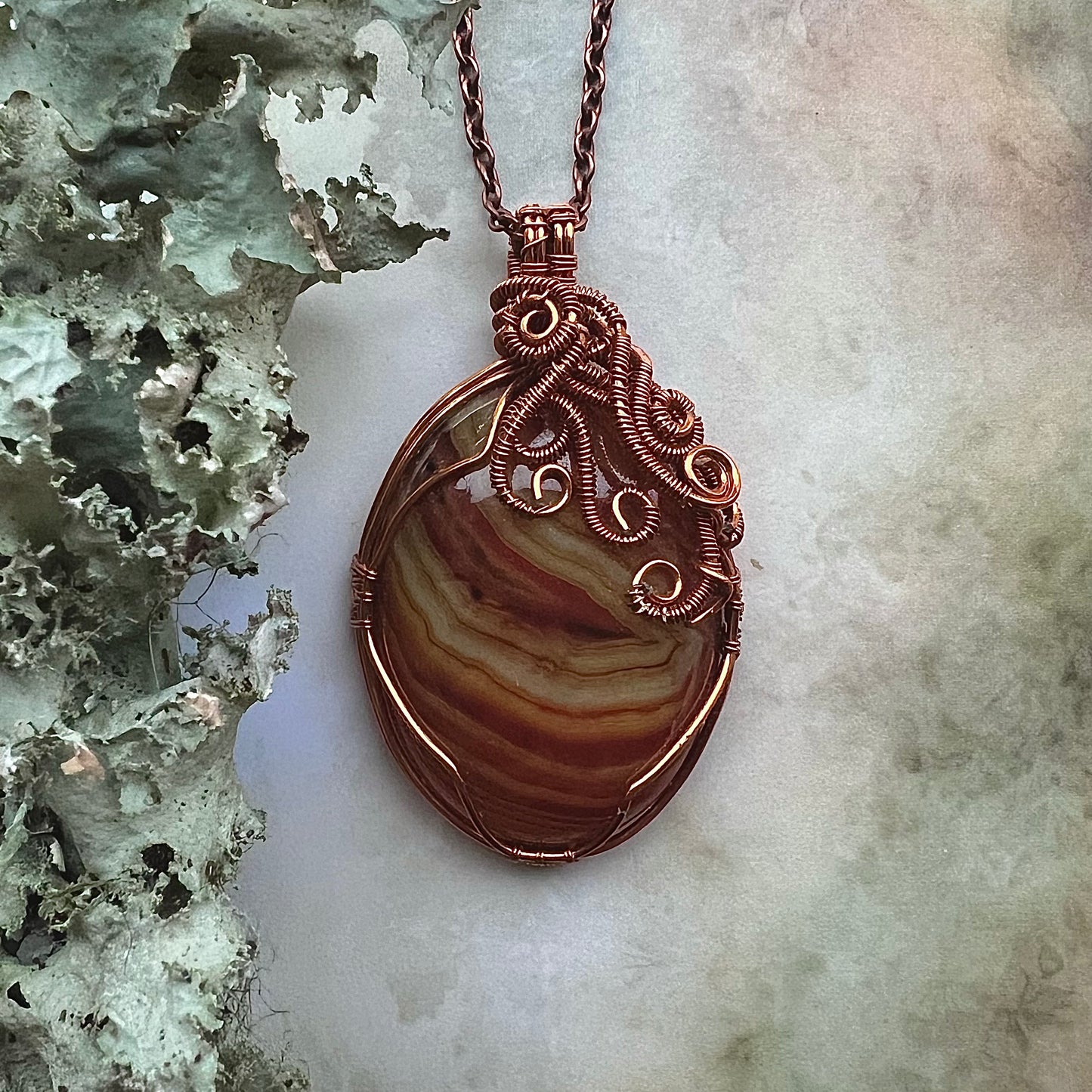 Necklace with dark orange lace agate and copper wire