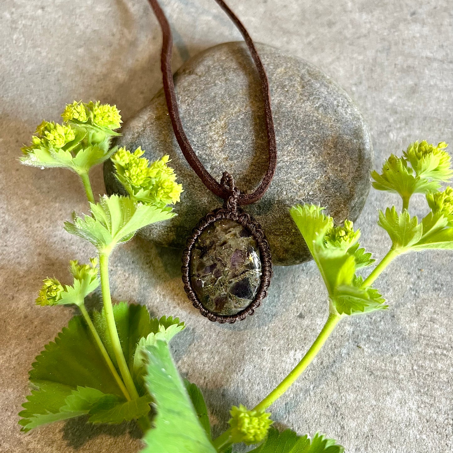 Necklace with bound, brass-lined amethyst