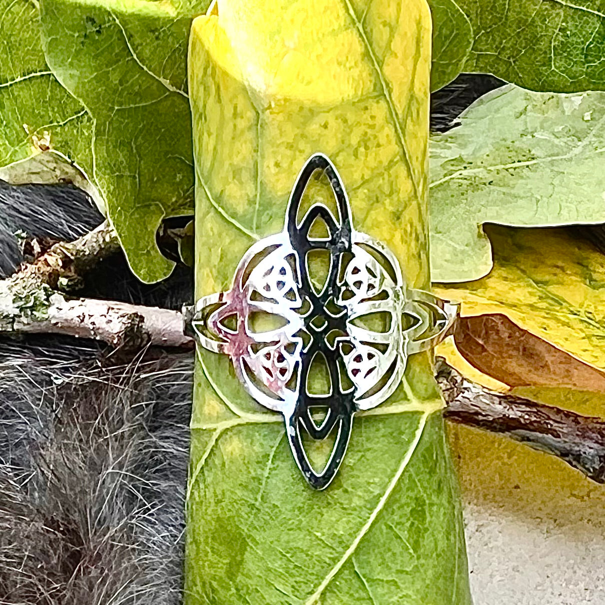 Adjustable stainless steel ring with Celtic knot and triquetras