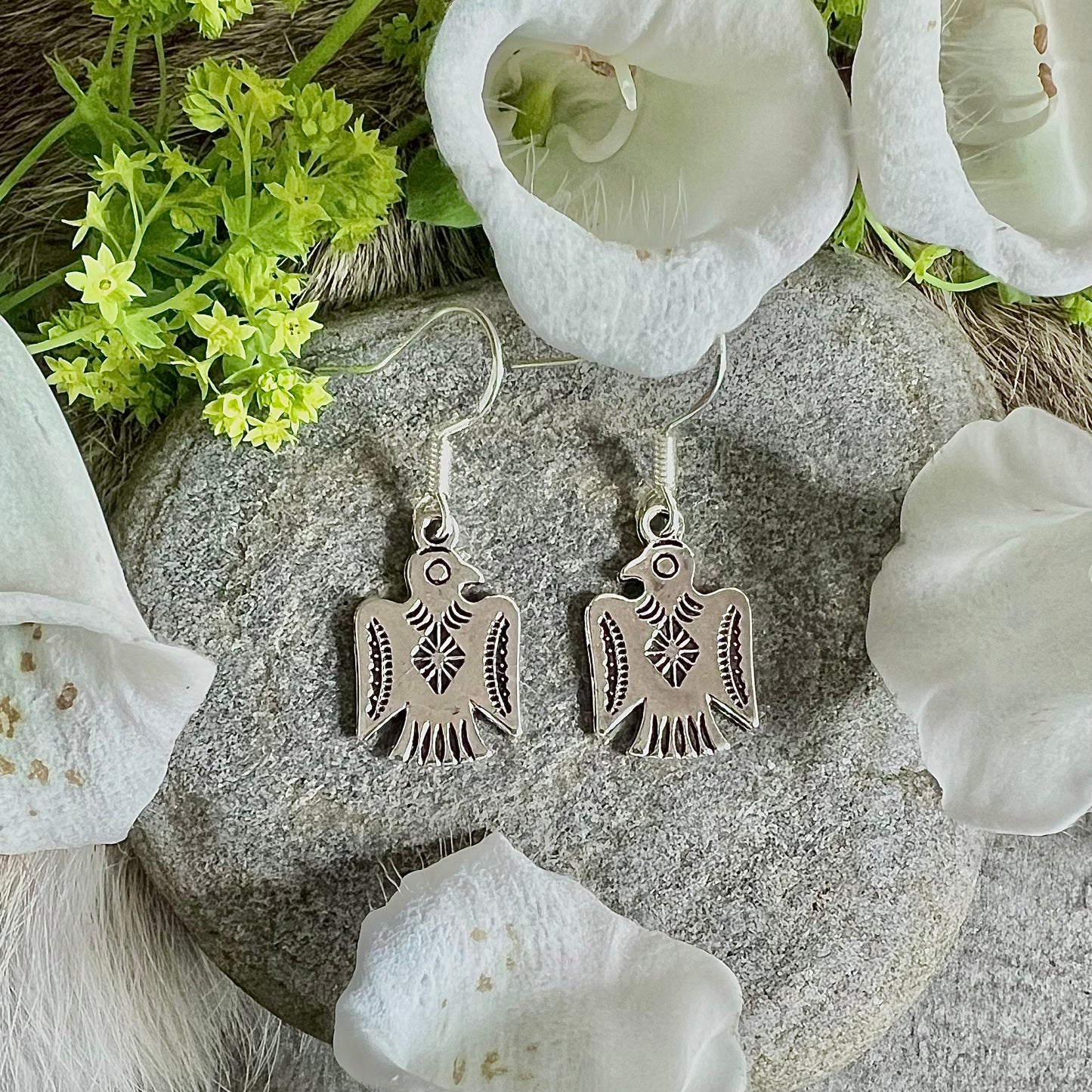 Earrings with thunderbirds on a silver hook