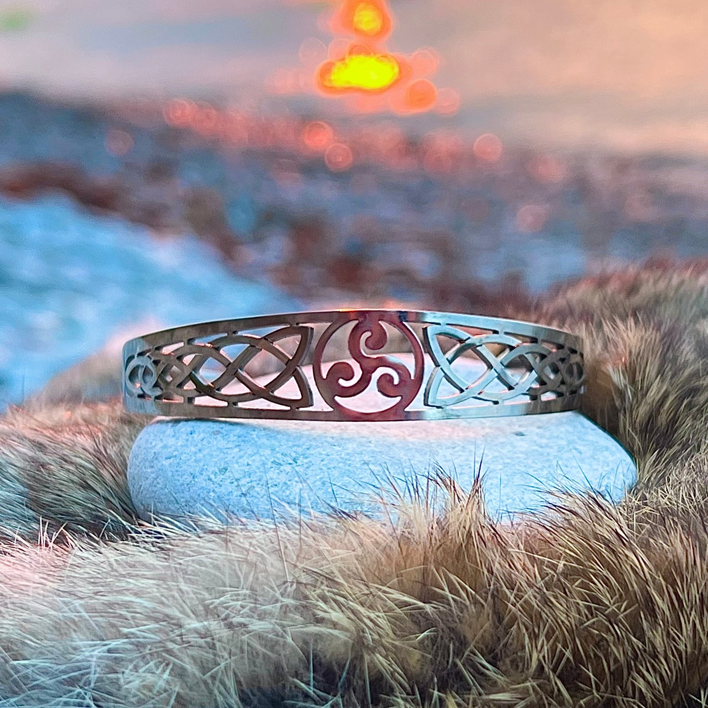 Rigid stainless steel bracelet with Triskelion