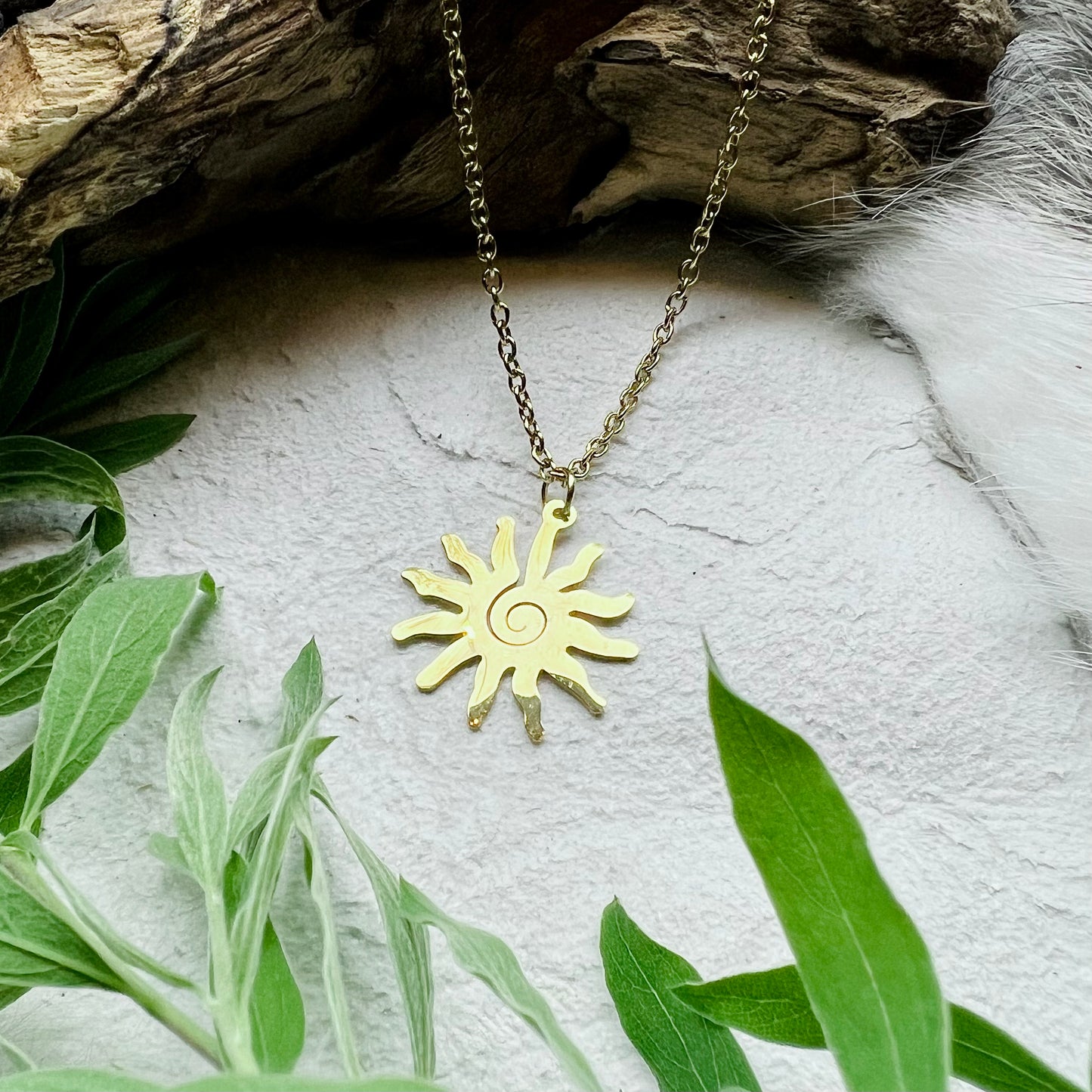 Necklace - Spiral Sun in gold colored steel