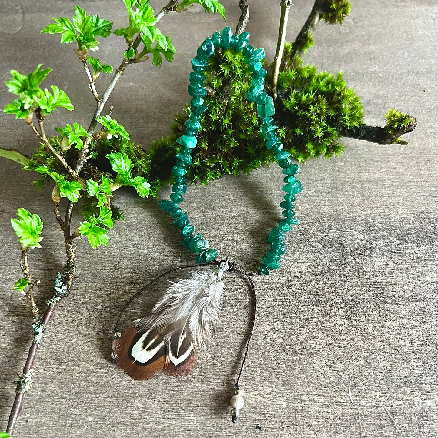 Anklet with jade and feathers