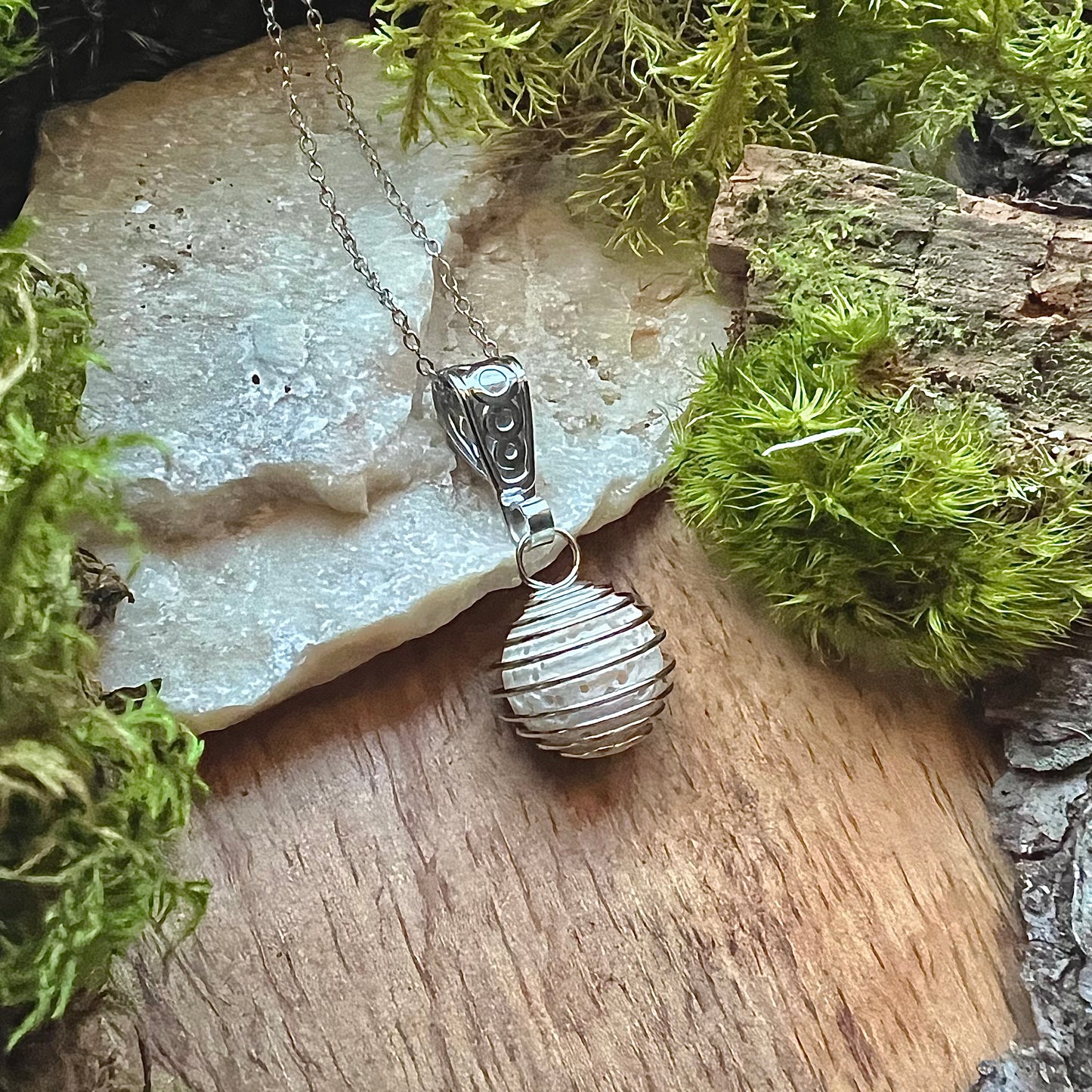 Necklace with spiral pearl hideaway and lava stone for perfume or fragrance oil