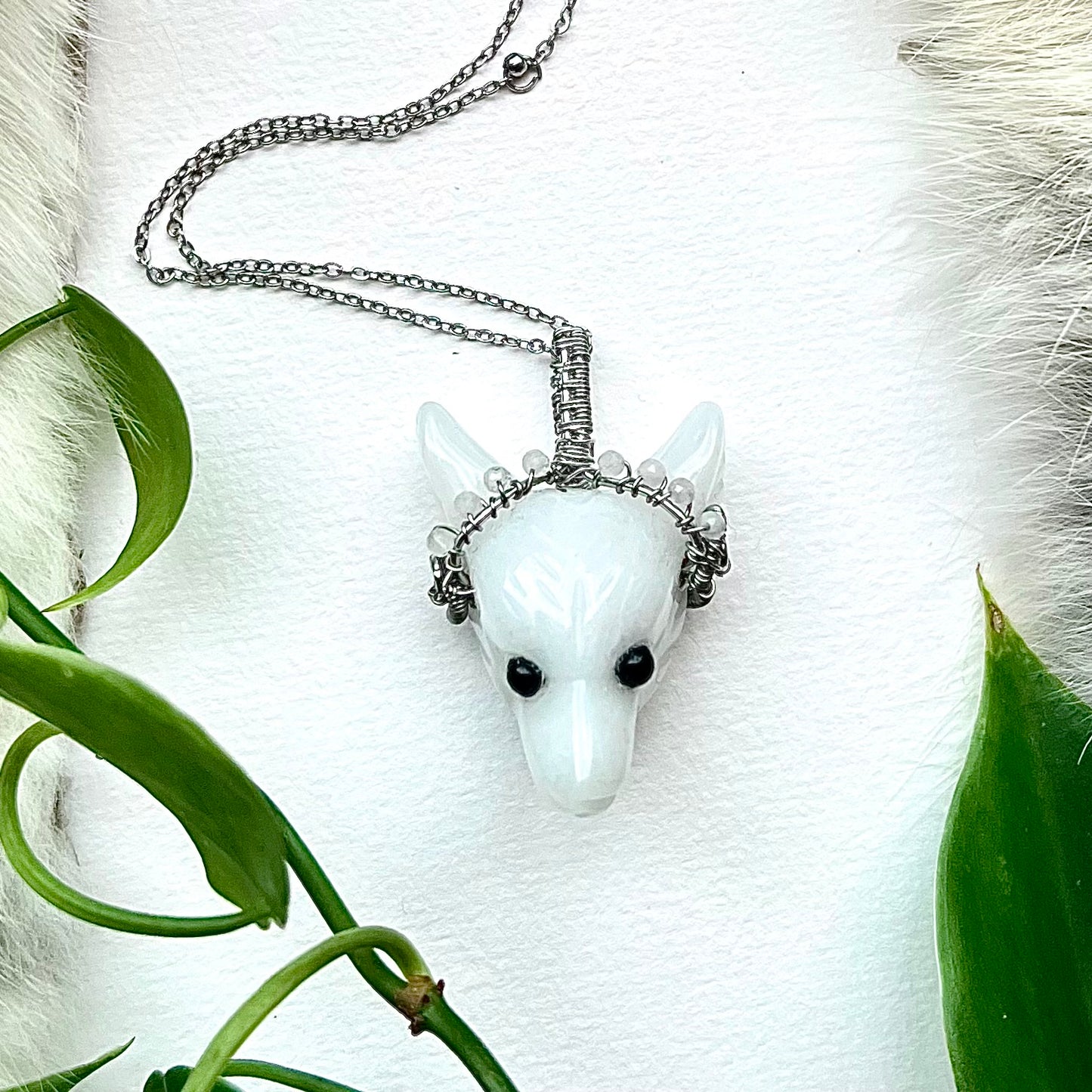 Necklace with wolf made of white agate, copper wire and moonstone