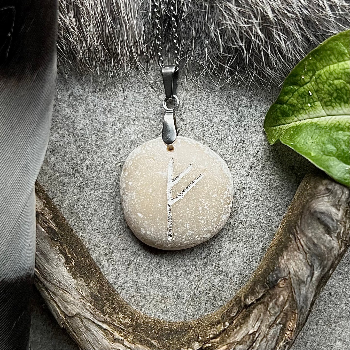 Necklace with hand-carved rune 'Fehu' for wealth in genuine silver