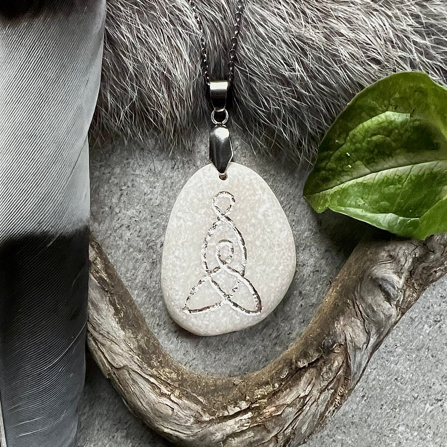 Necklace with hand-carved symbol 'mother and child' in sterling silver