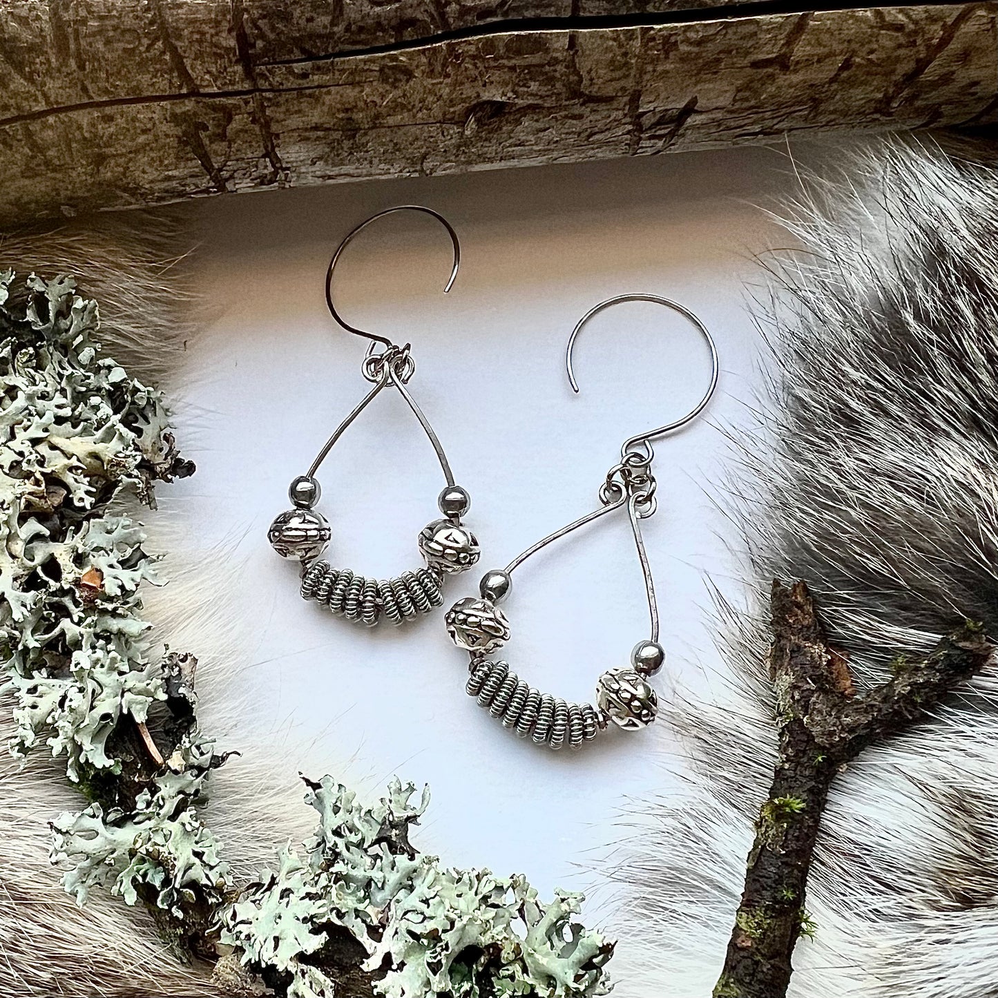 Viking model earrings with spun, silver colored copper