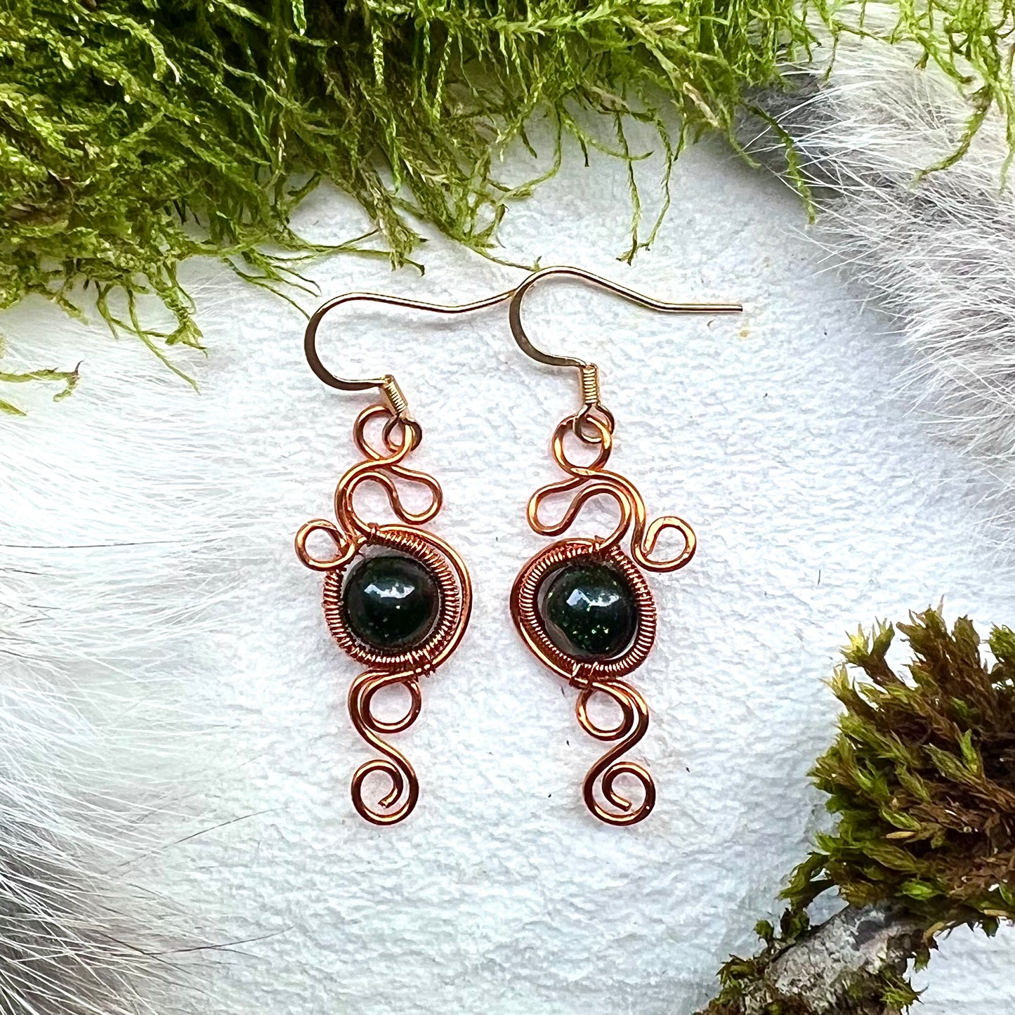 Earrings with blue gold stone and copper wire
