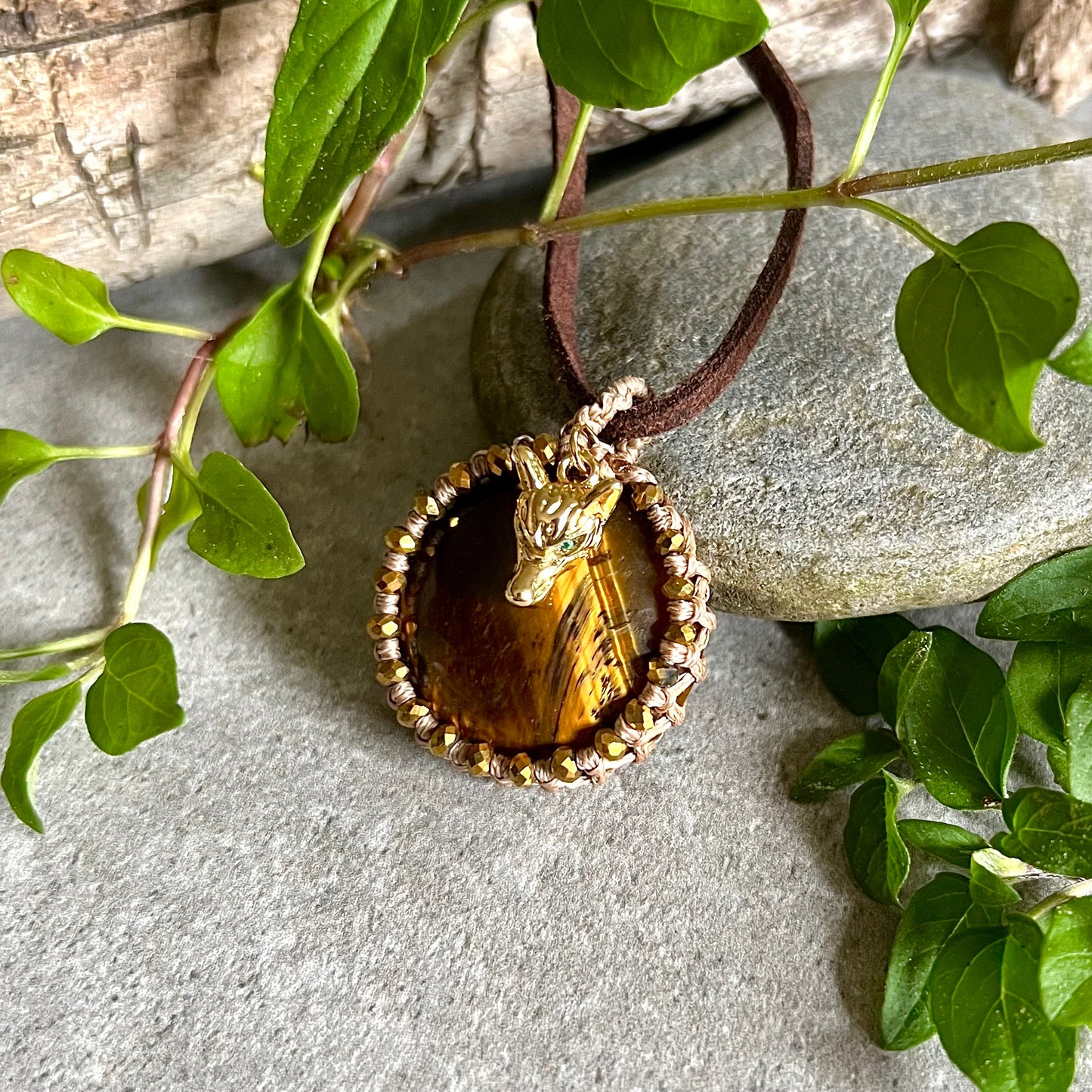 Necklace with bound tiger eye and gold-plated wolf head