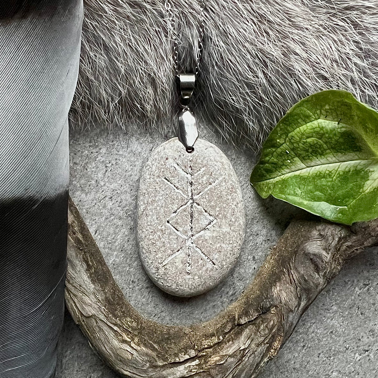 Necklace with hand-carved rune for prosperity in sterling silver