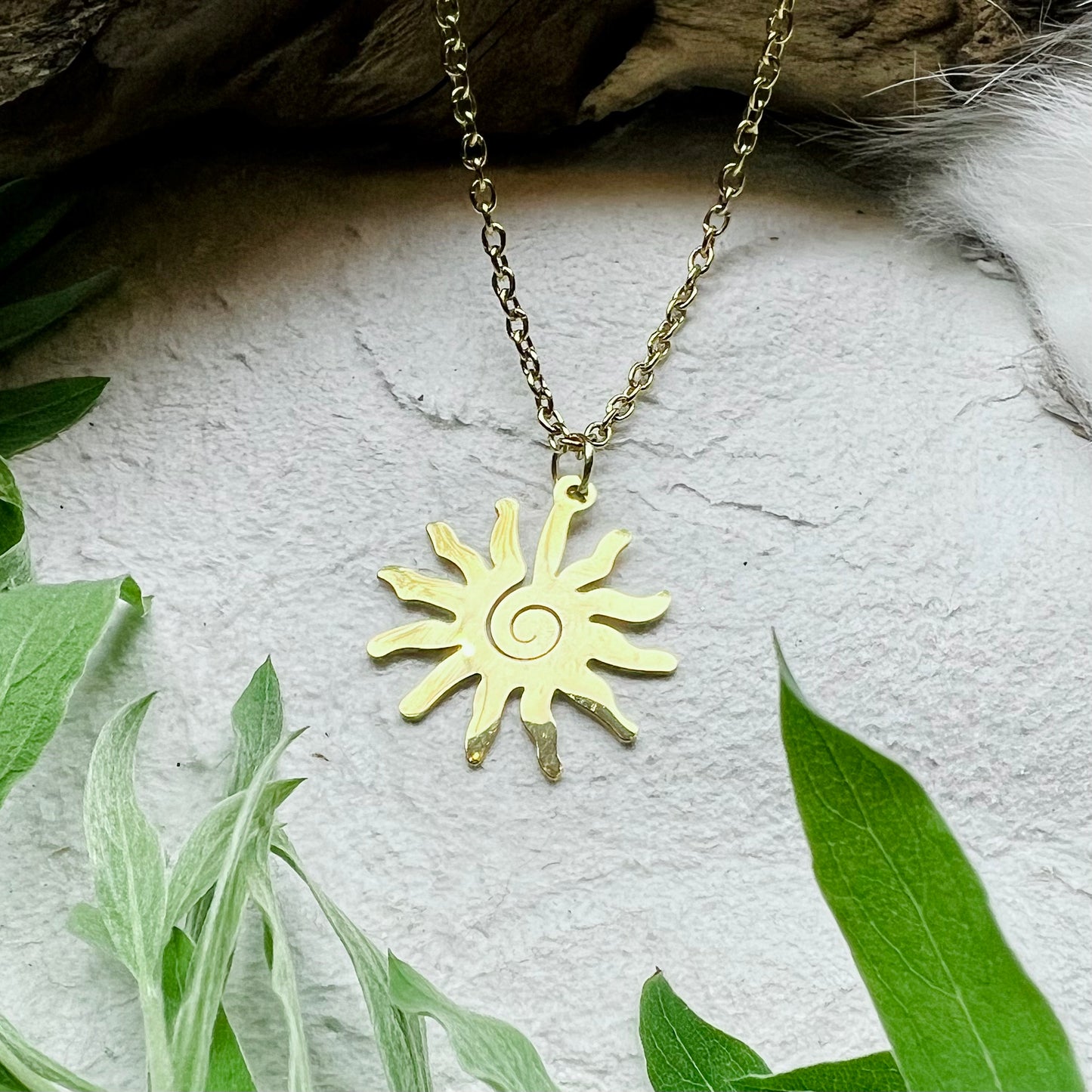 Necklace - Spiral Sun in gold colored steel