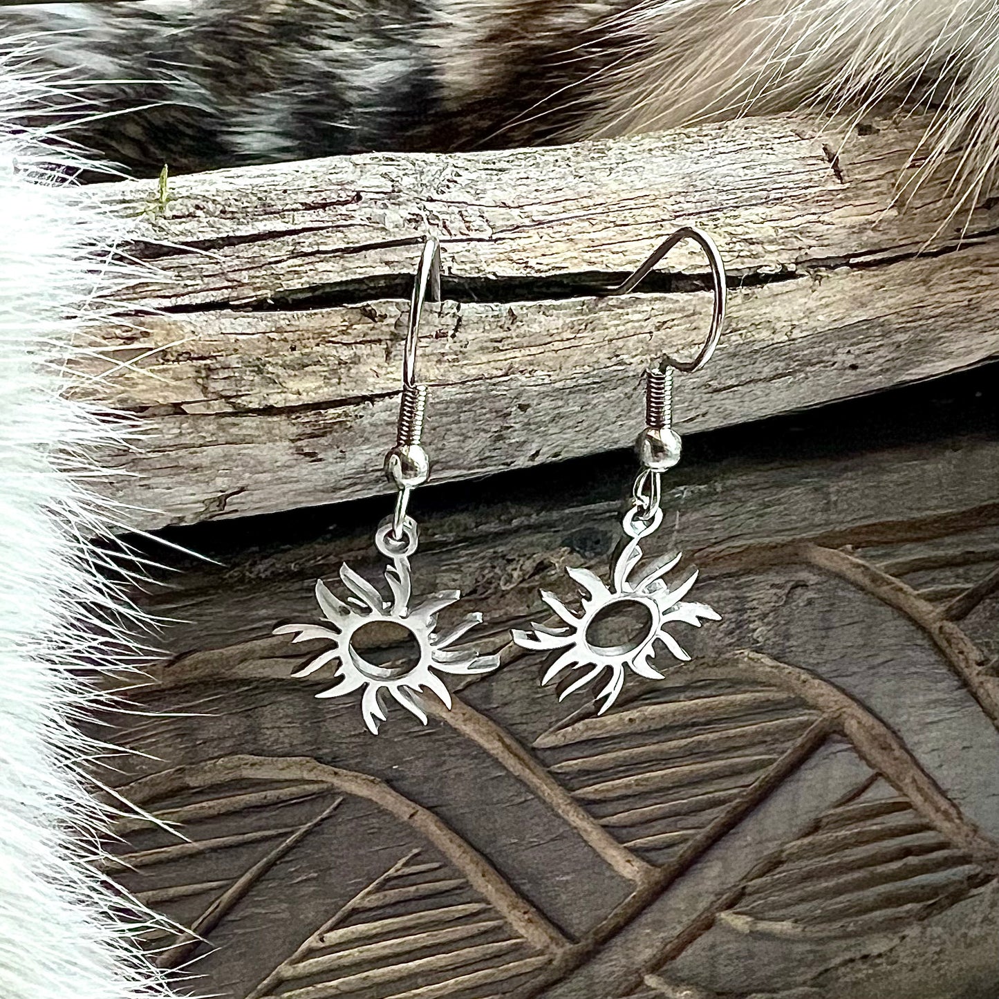 Earrings with sun in stainless steel