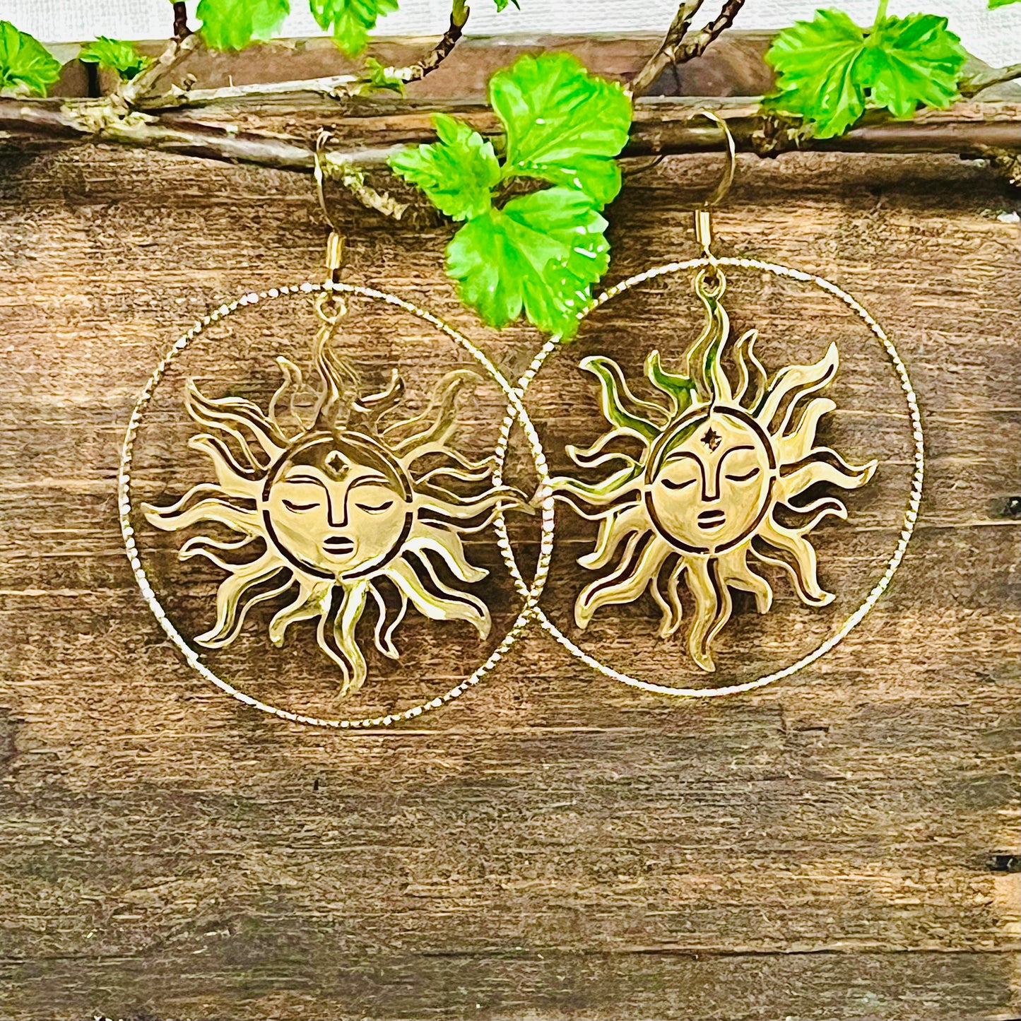 Earrings with sun in a ring, plated in 18K gold