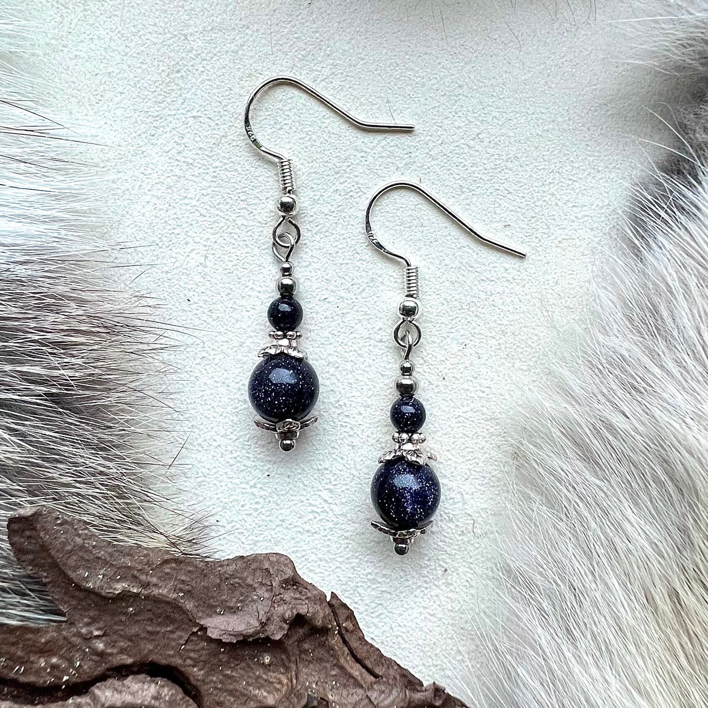 Earrings with blue gold stone and silver