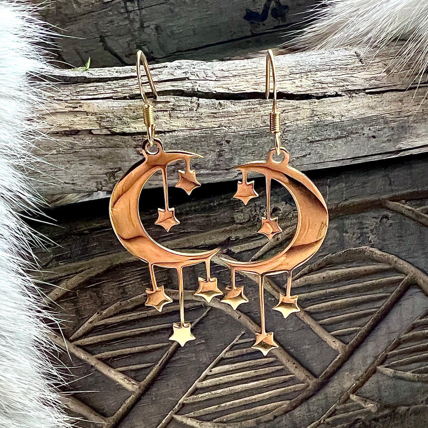 Earrings with moon and stars in gold-colored steel