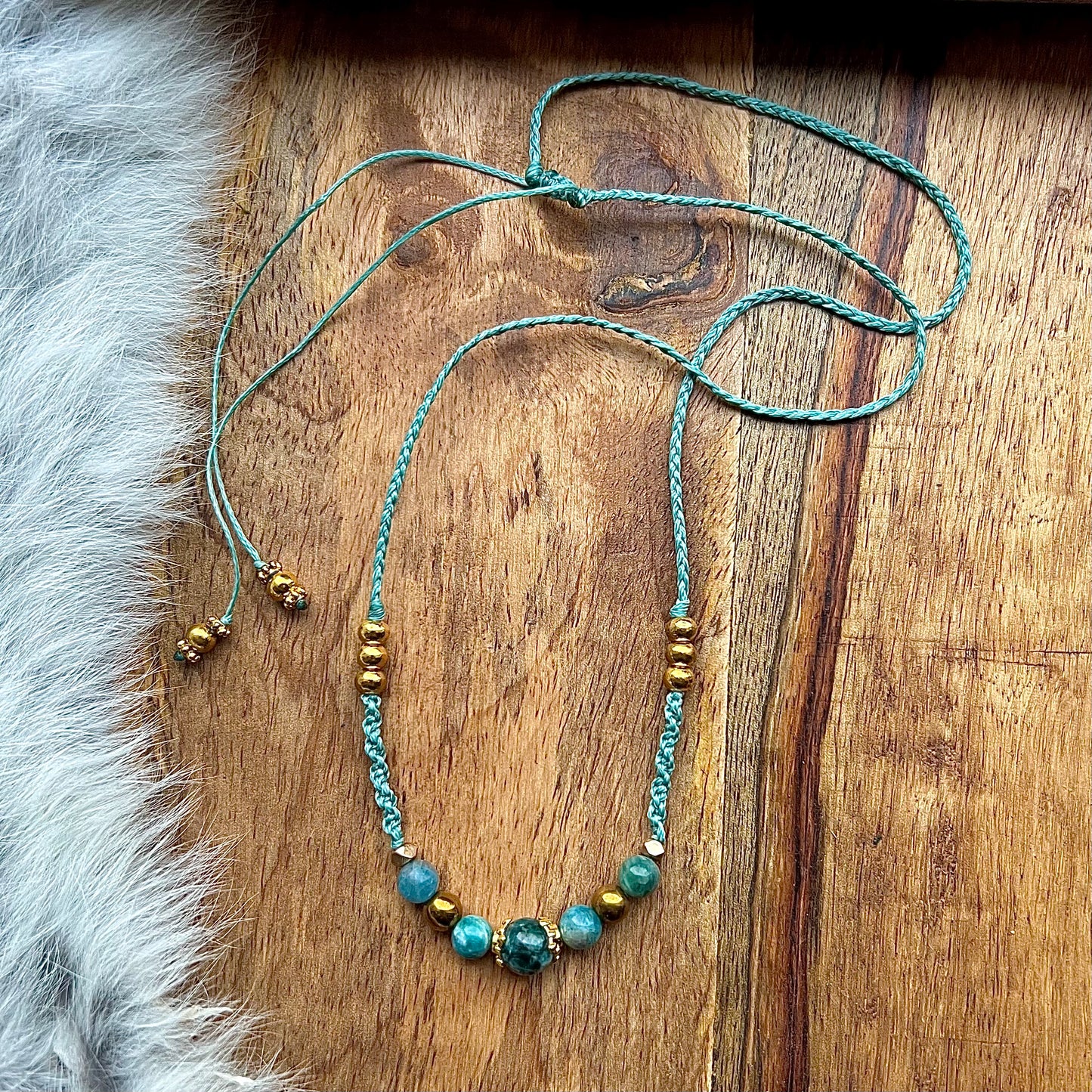 Hand-knotted necklace with apatite and brass beads