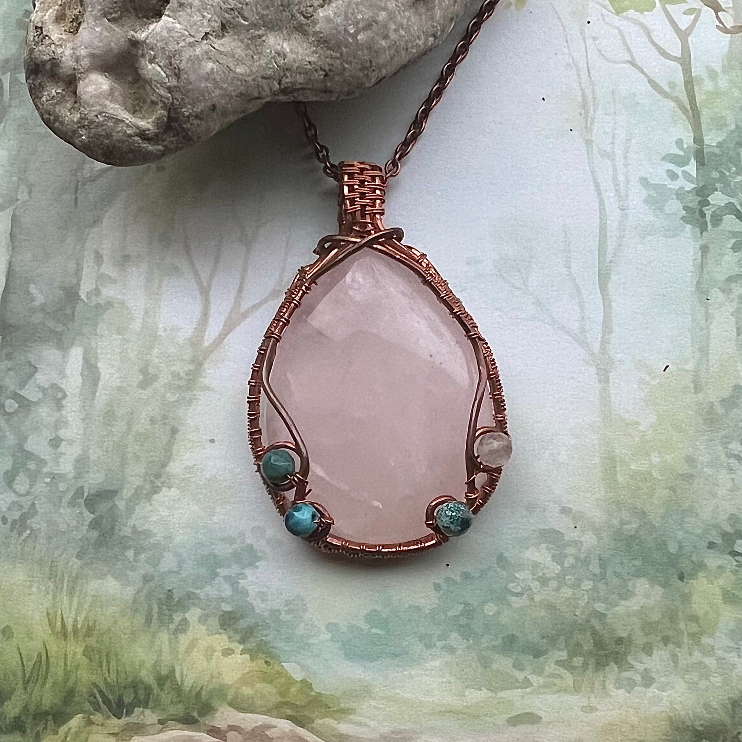 Necklace with large rose quartz and copper wire