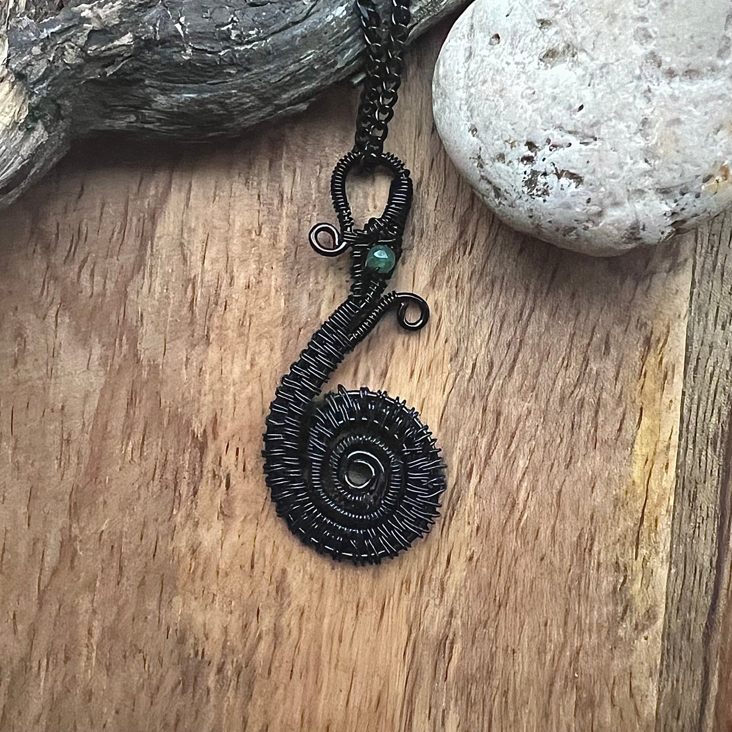 Necklace with the Midgard Serpent of black copper wire and eye of jade