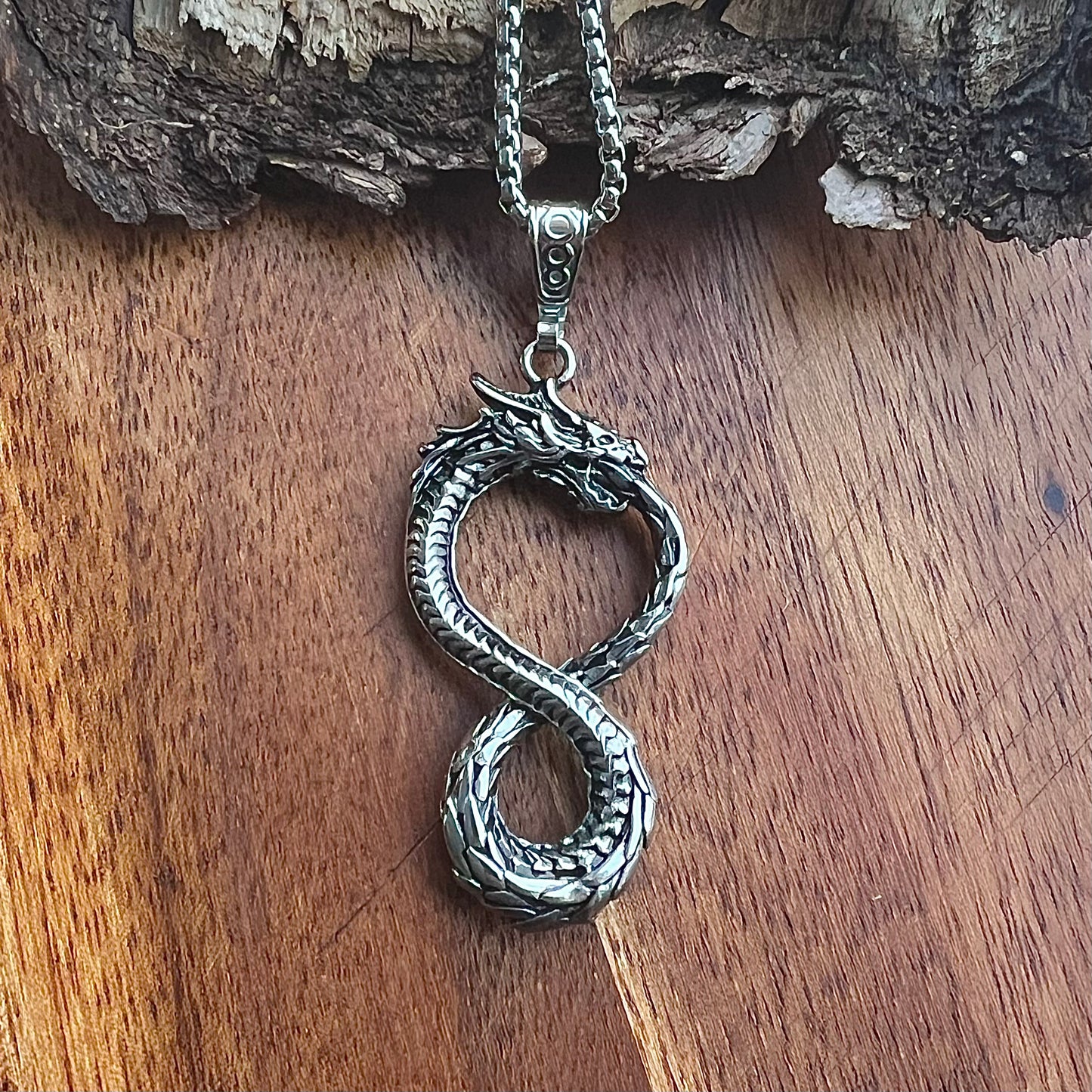 Necklace with Nidhögg biting its tail