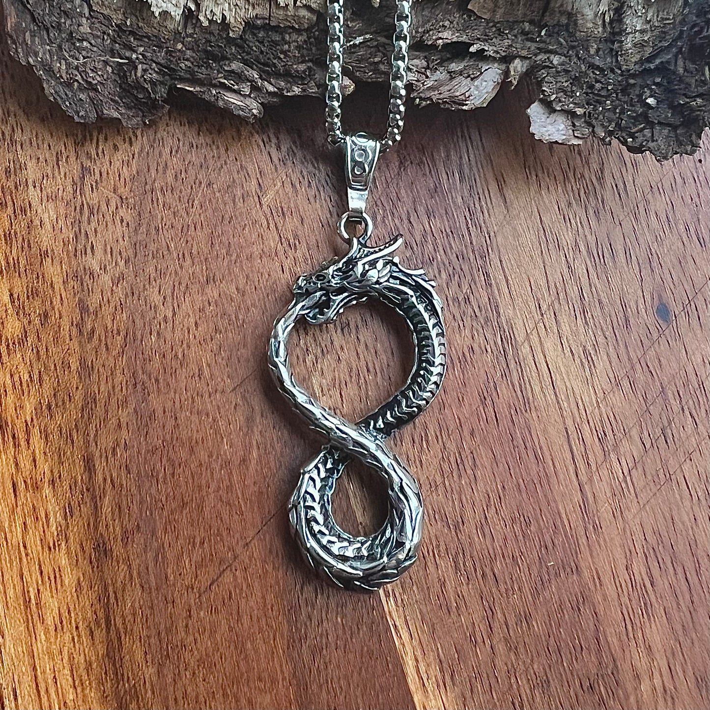 Necklace with Nidhögg biting its tail