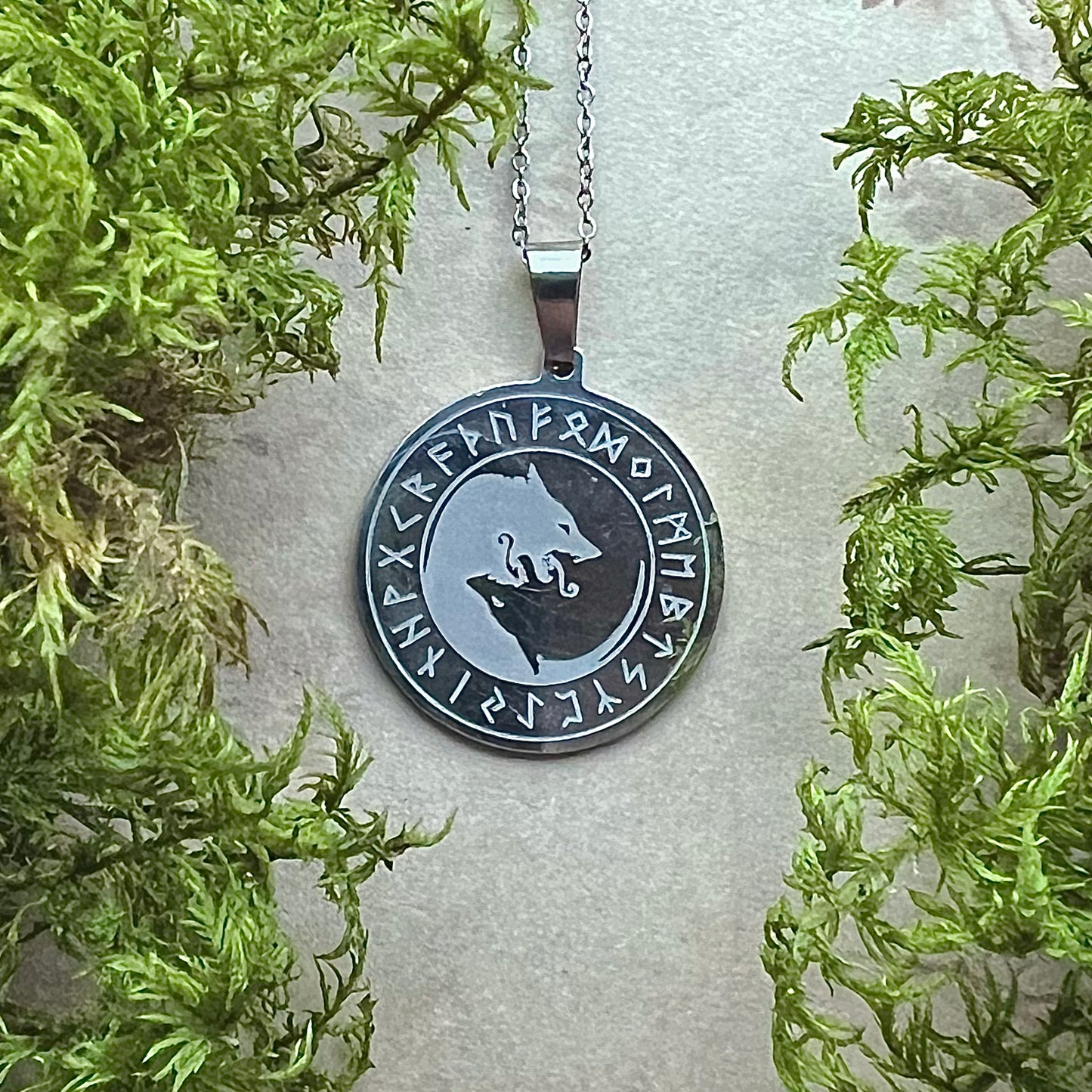 Necklace with Skoll and Hate, etched in a ring of runes