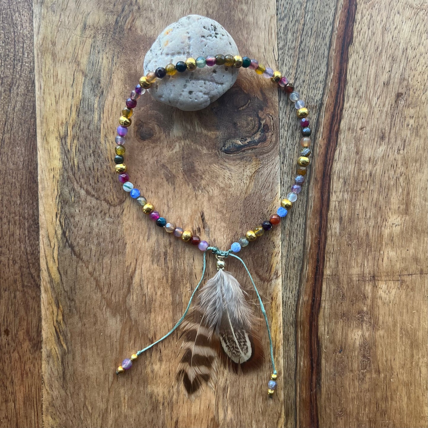Anklet with faceted agate, brass and feather pendant