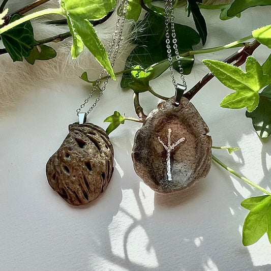 Peach core necklace with hand-carved rune in genuine silver. Protection amulet