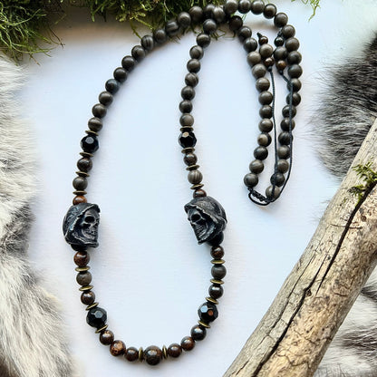 Necklace of wood lace agate, sparkling bronzite and black brass skulls