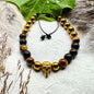 Bracelet with steel skull and tiger's eye