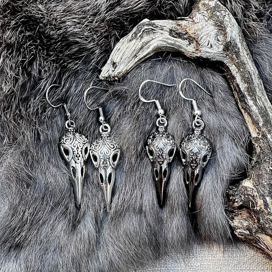 Earrings with raven head