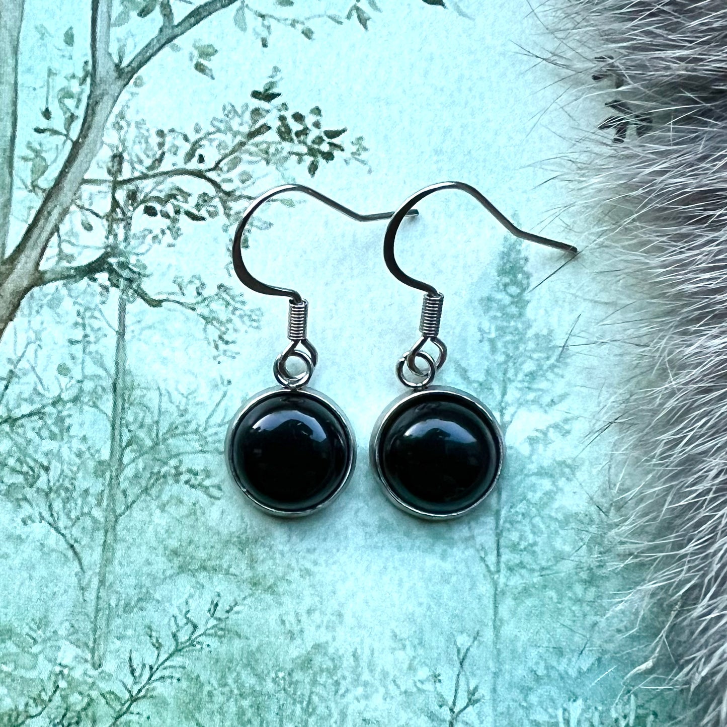 Kristallörhängen i stål med svart agat
