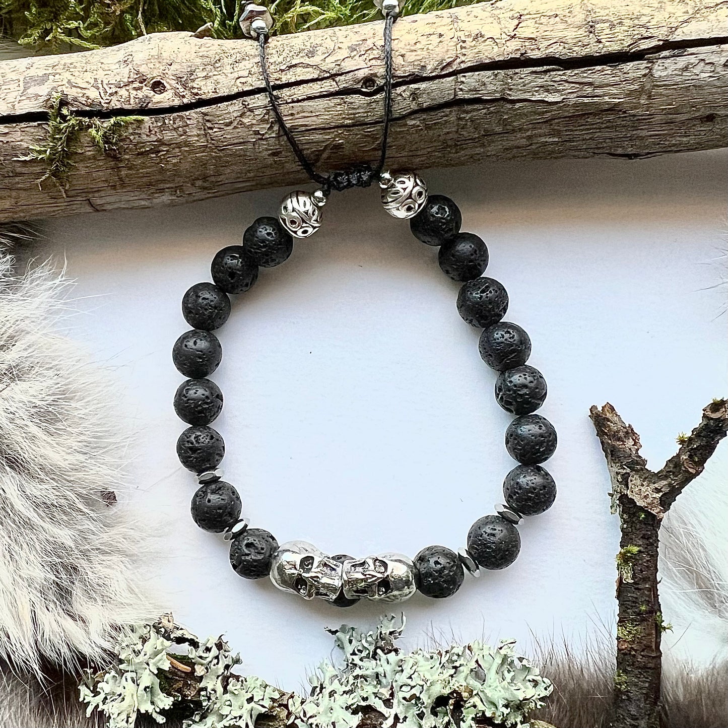 Lava stone bracelet with stainless steel skulls