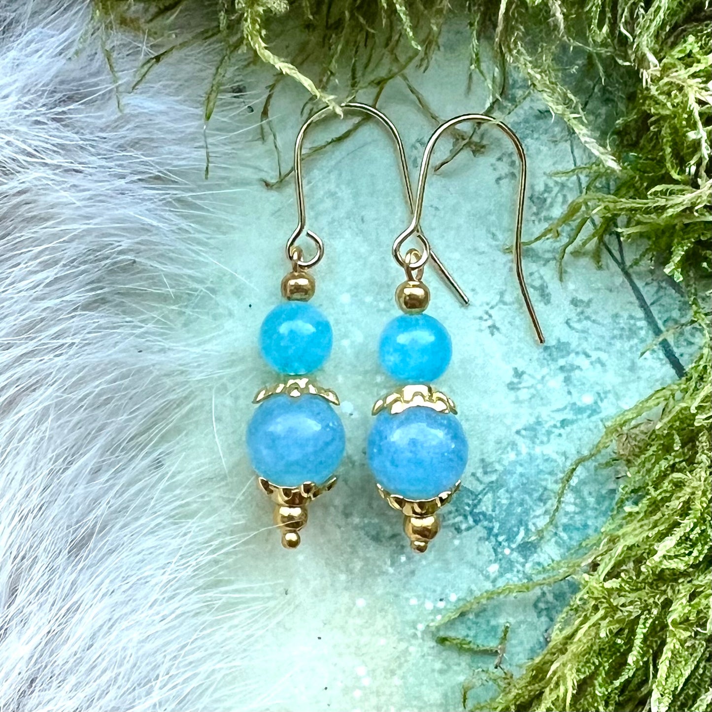 Kristallörhängen med akvamarin och guldfärgat stål