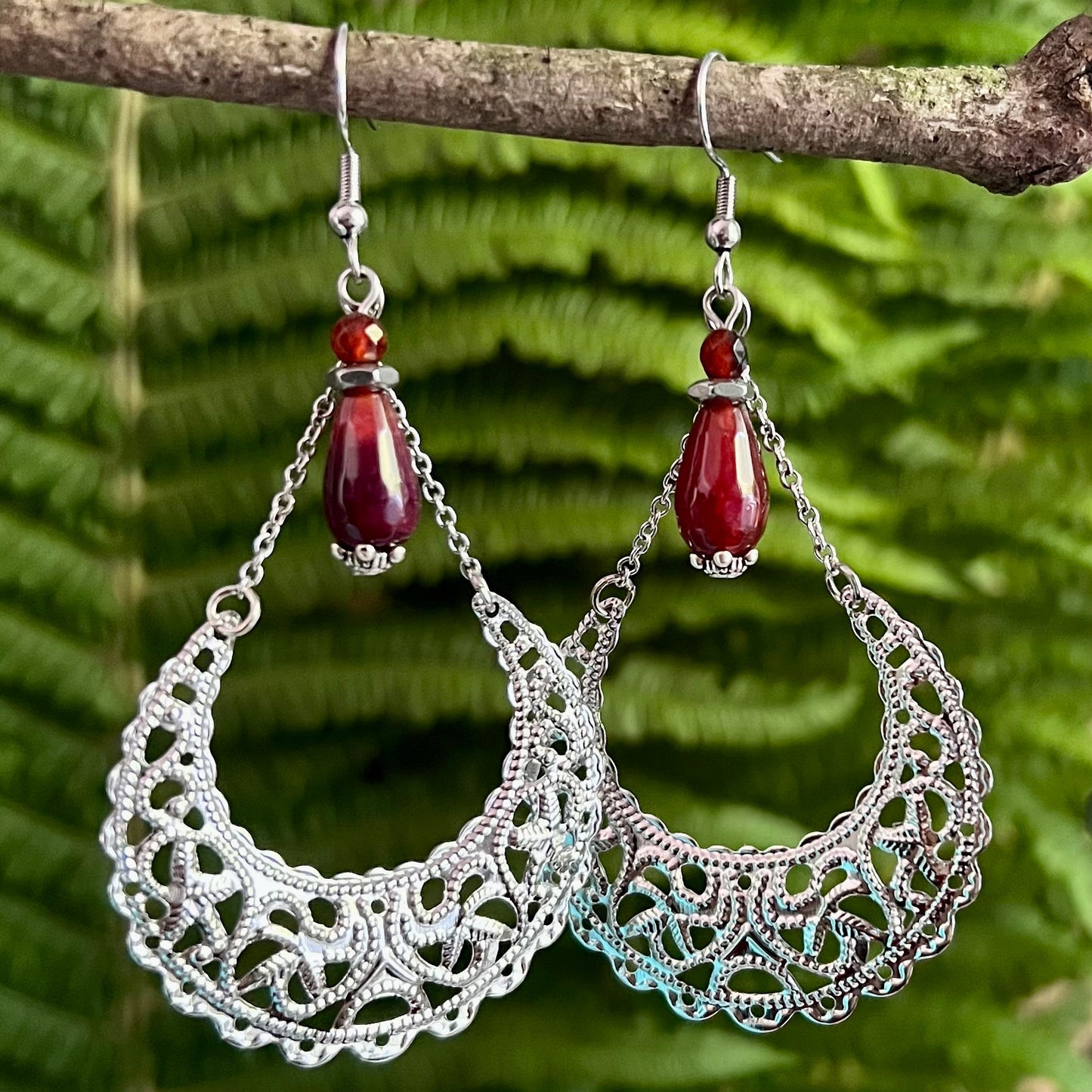 Earrings with crescent moon and red agate drop