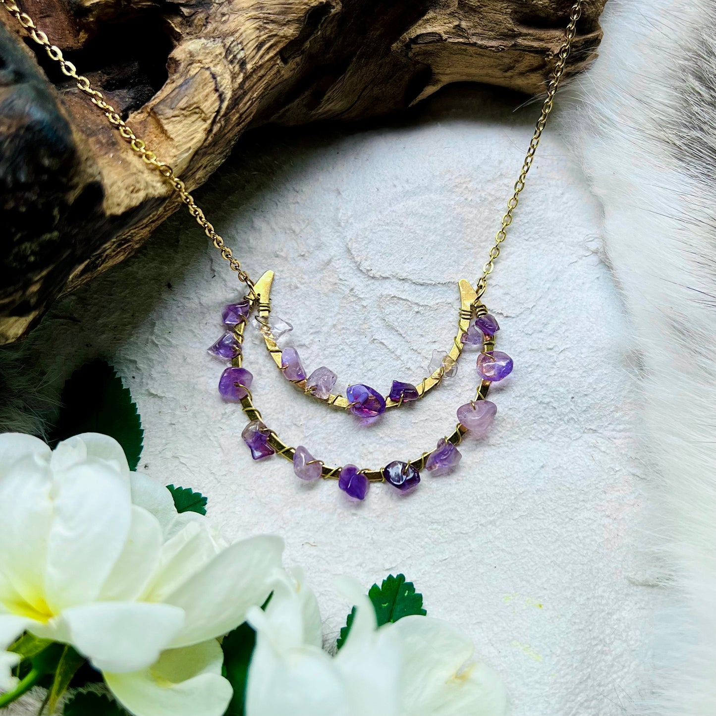 Necklace with crescent moon and amethyst