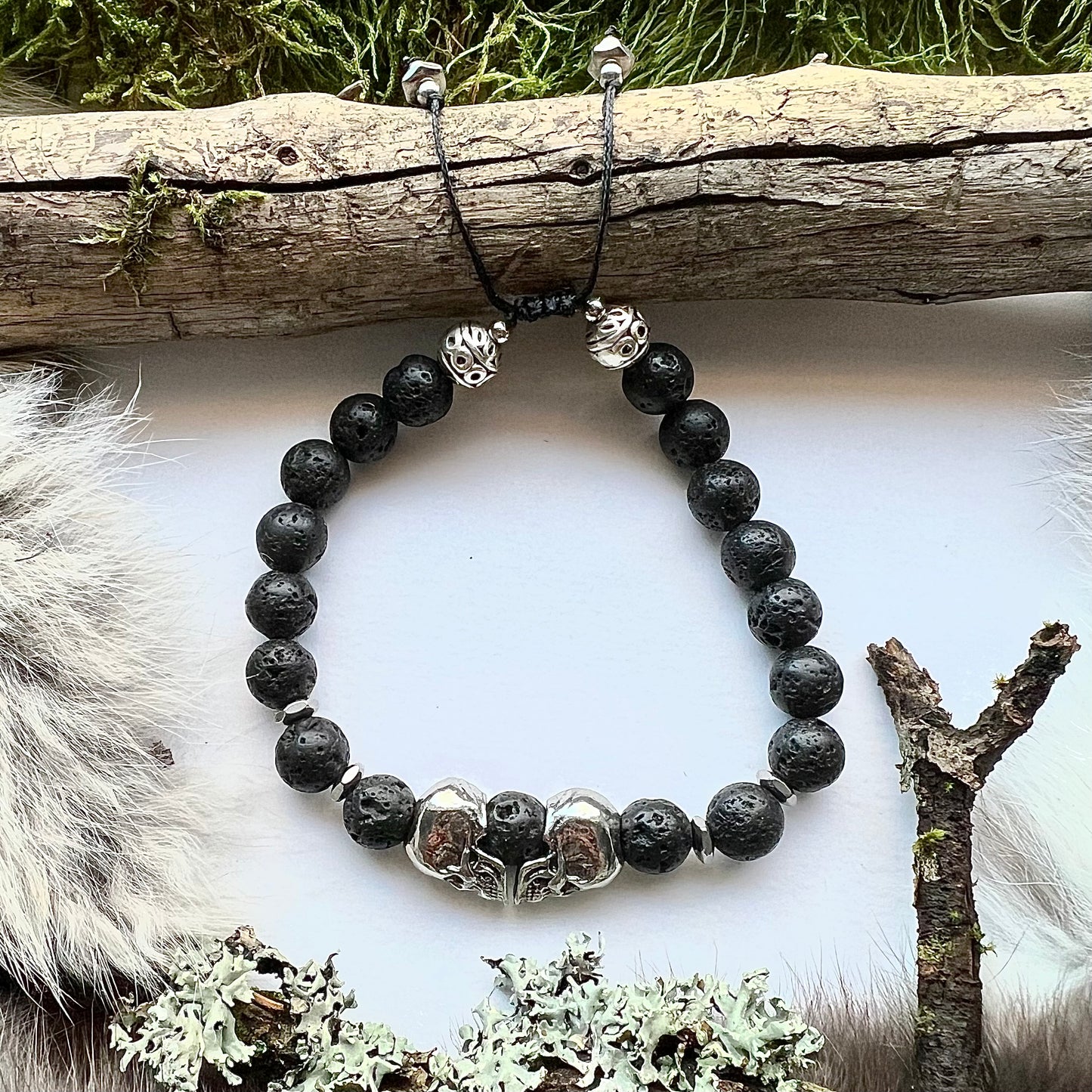 Lava stone bracelet with stainless steel skulls