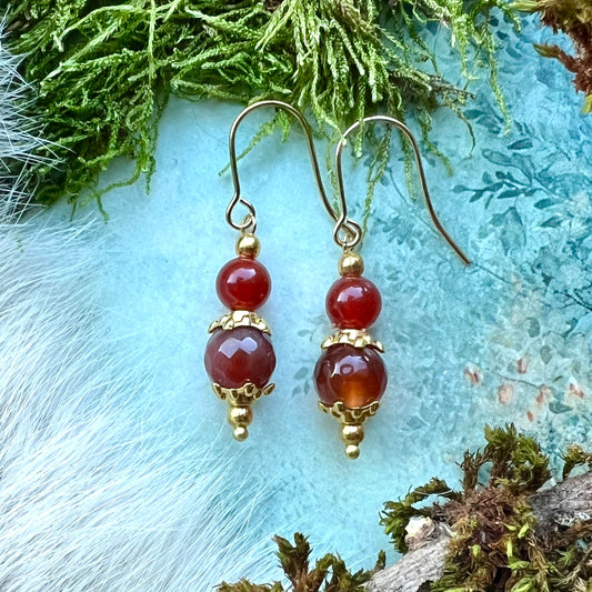 Kristallörhängen med karneol och guldfärgat stål