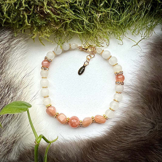 Bracelet "June night" of white, frosted jade and sunstone with gold-colored brass details