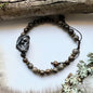 Bracelet with wood lace agate, sparkling bronzite and black brass skull