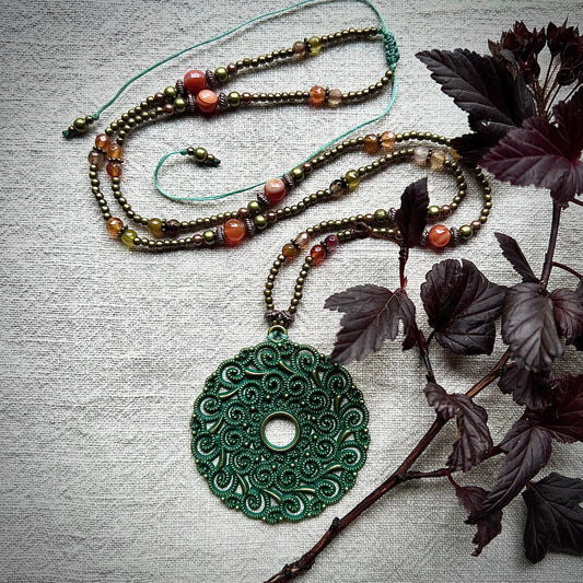 Brazilian agate necklace with bronze colored beads and metal pendant with green patina