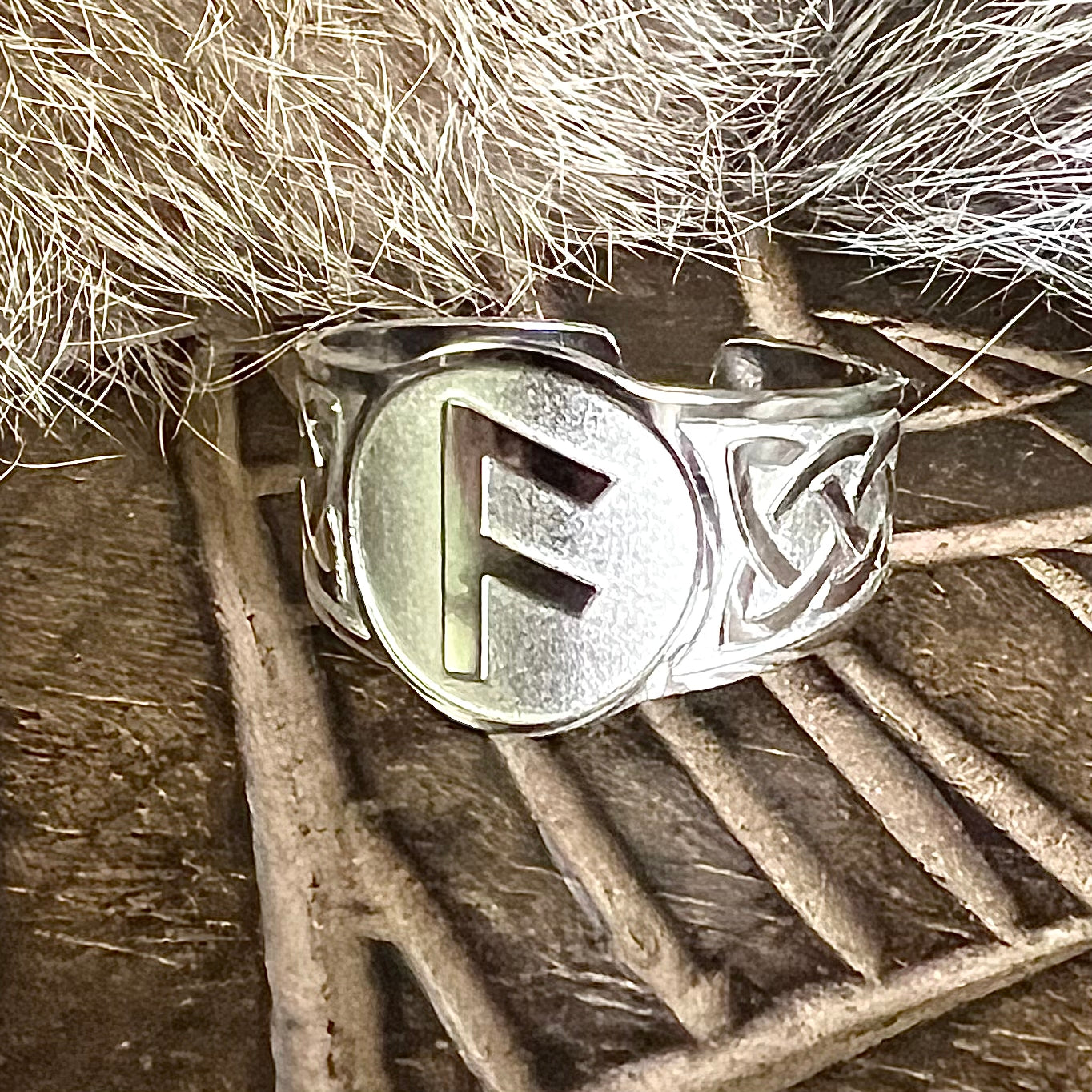 Adjustable steel ring with the Ansuz rune