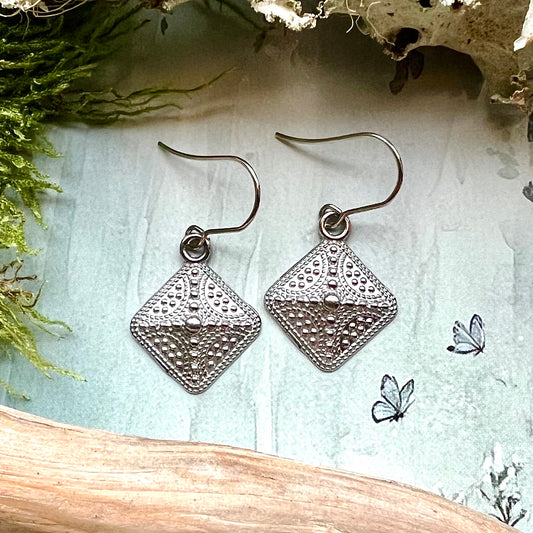 Örhängen, vikingatida platta i rostfritt stål