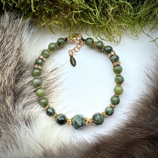 Bracelet "Mother Earth" made of green jade and kambaja stove with gold-colored brass details