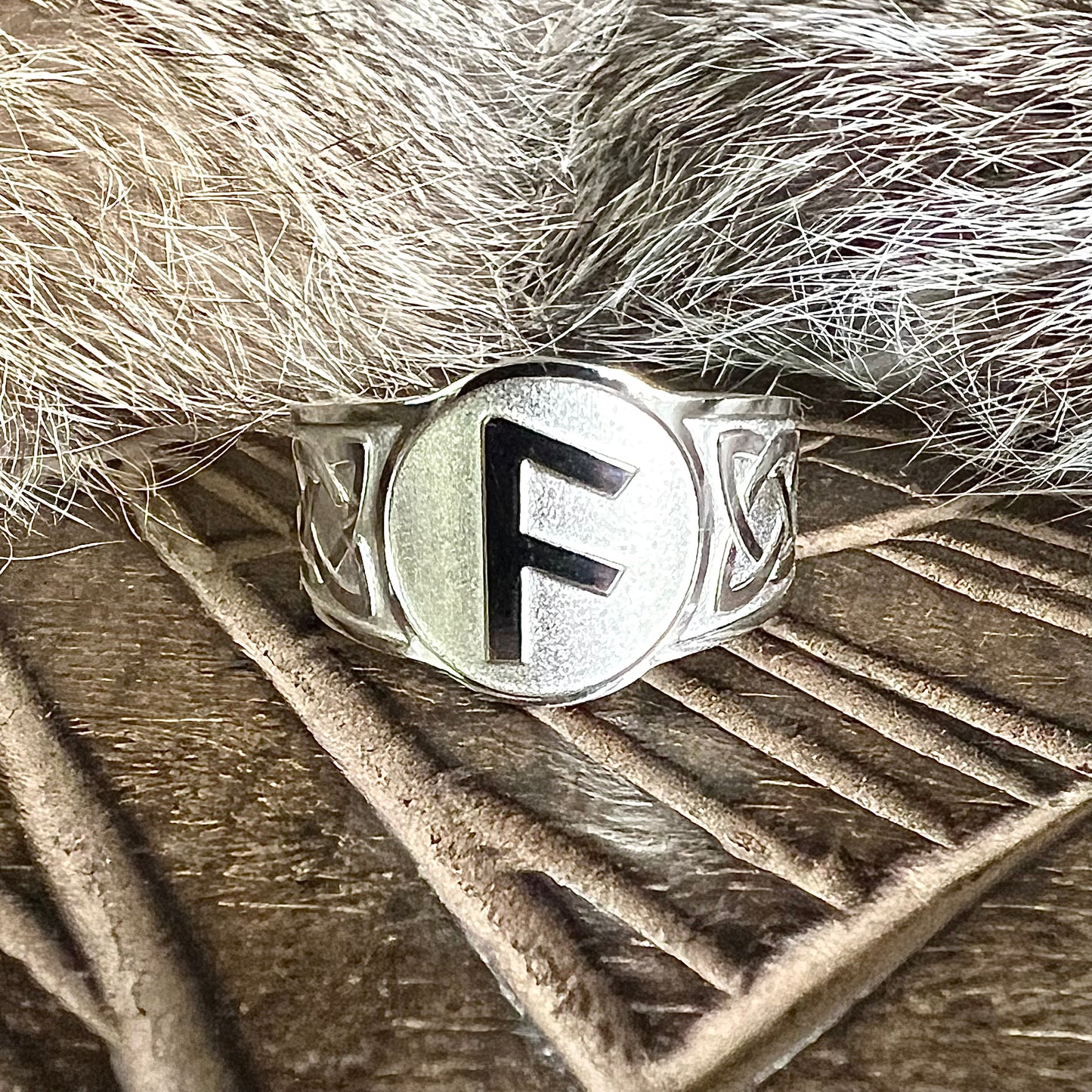 Adjustable steel ring with the Ansuz rune