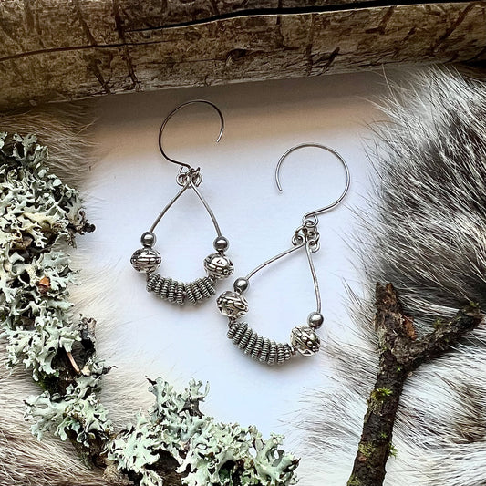 Viking model earrings with spun, silver colored copper